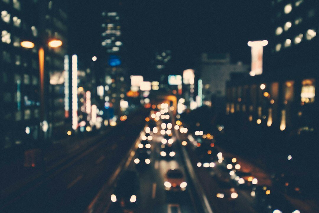 City street illuminated by lights at night