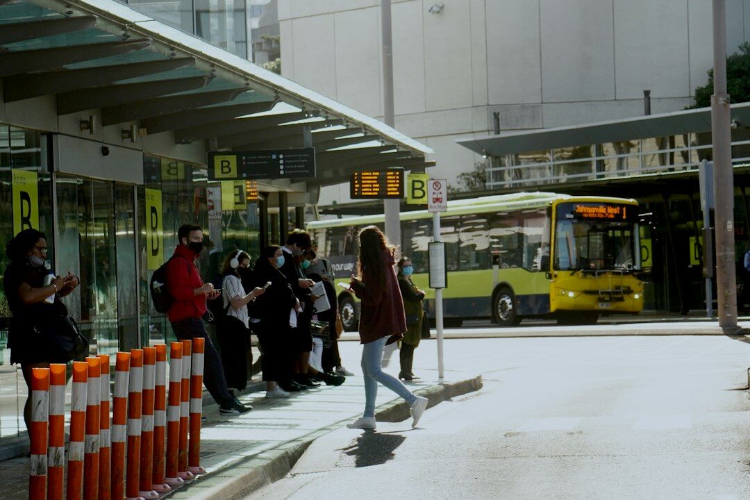 Passengers waiting at an urban bus station